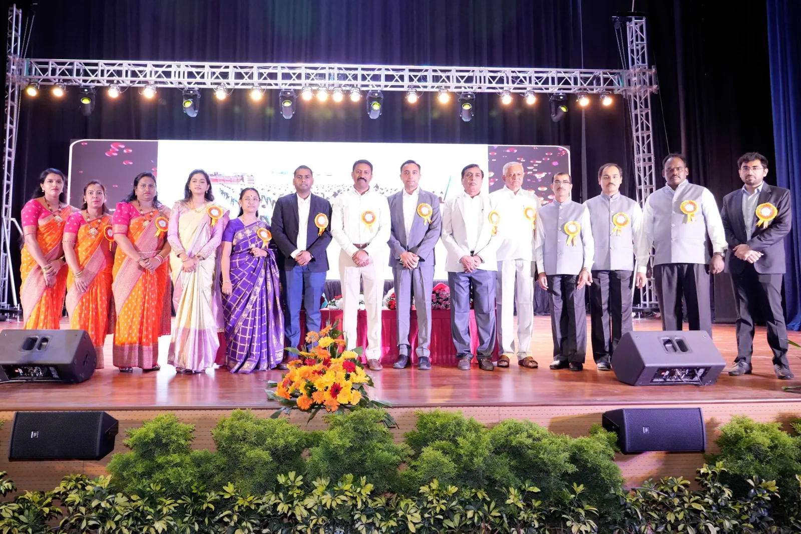 The full cast of students and staff taking a bow together on the Annual Day stage