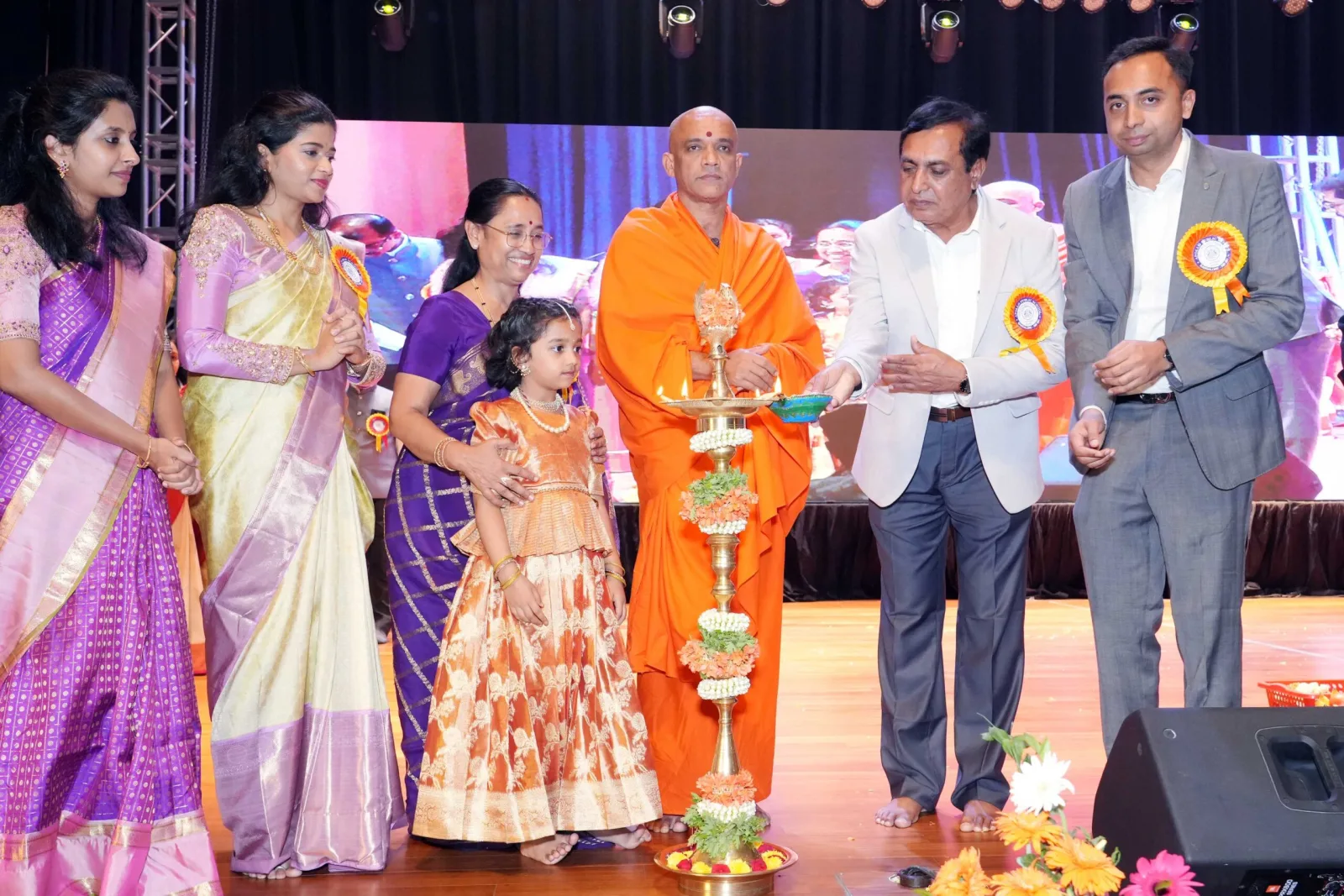 School management lighting a ceremonial lamp on the Annual Day stage
