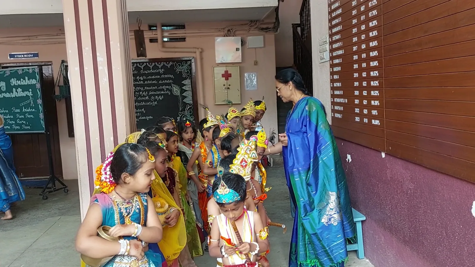 Students in traditional costume preparing backstage before a cultural performance